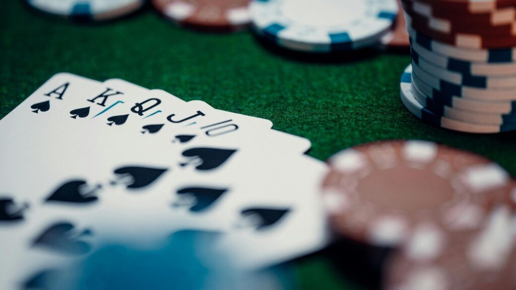 Playing cards and poker chips on a casino table symbolizing online casino tech stack