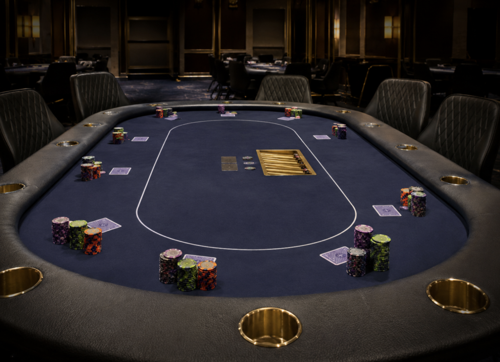 Prepared poker tournament table with chips and cards in a dimly lit room
